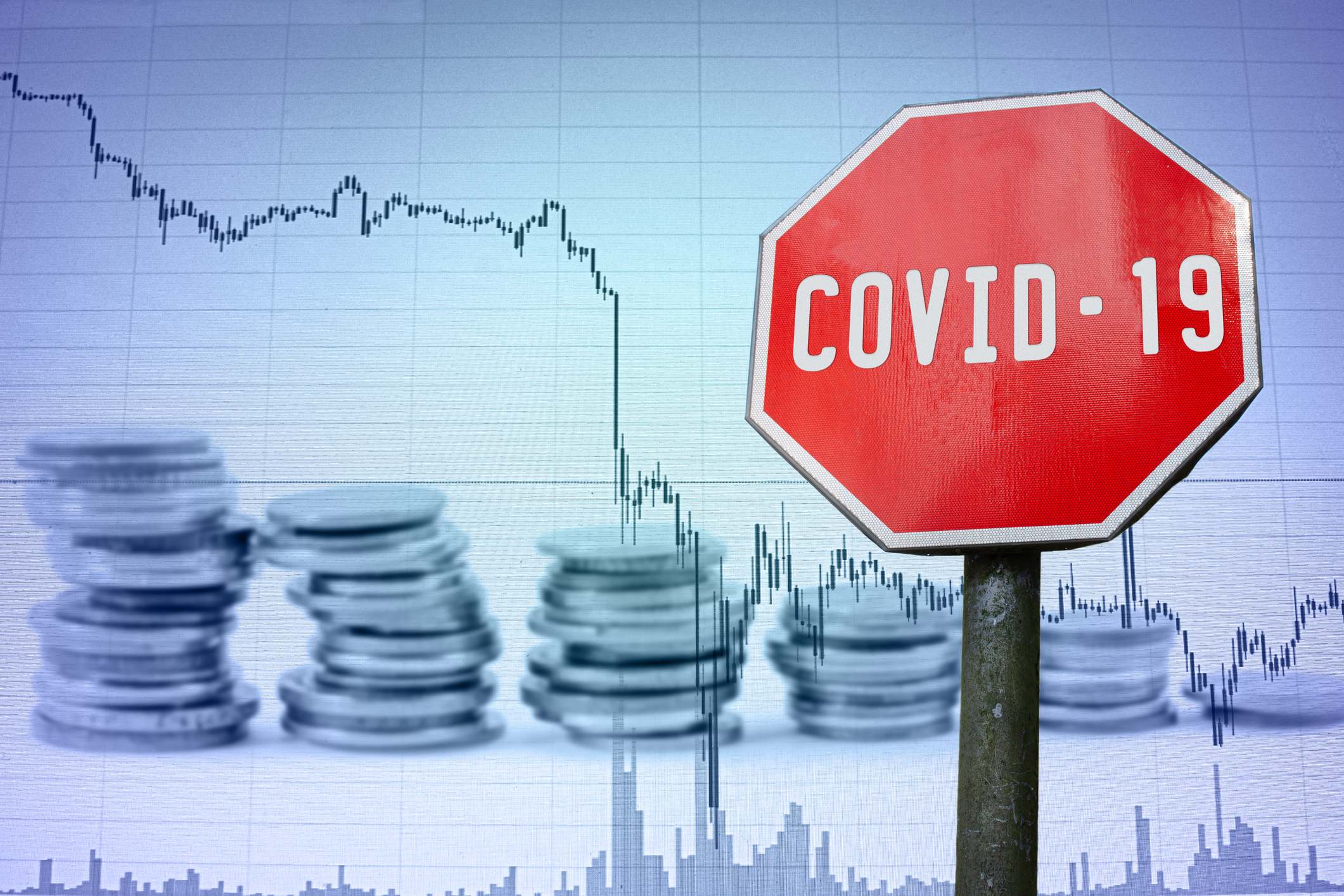 covid 19 sign on economy background graph and coins 177366885